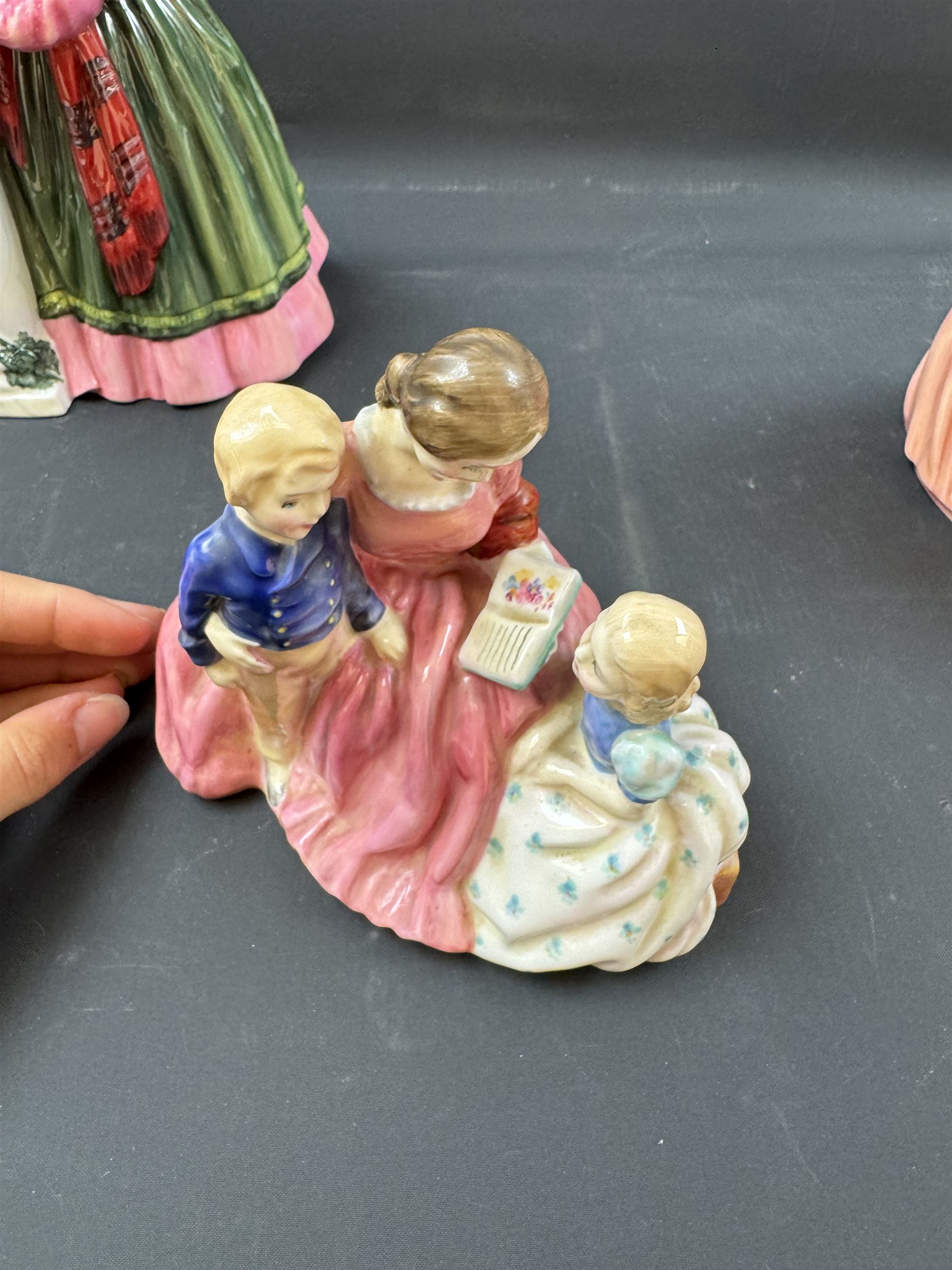 Four Royal Doulton figures, comprising Florence Nightingale HN3144, The Bedtime Story HN2059, Lady Charmain HN1949 and Sweet Anne HN1315 