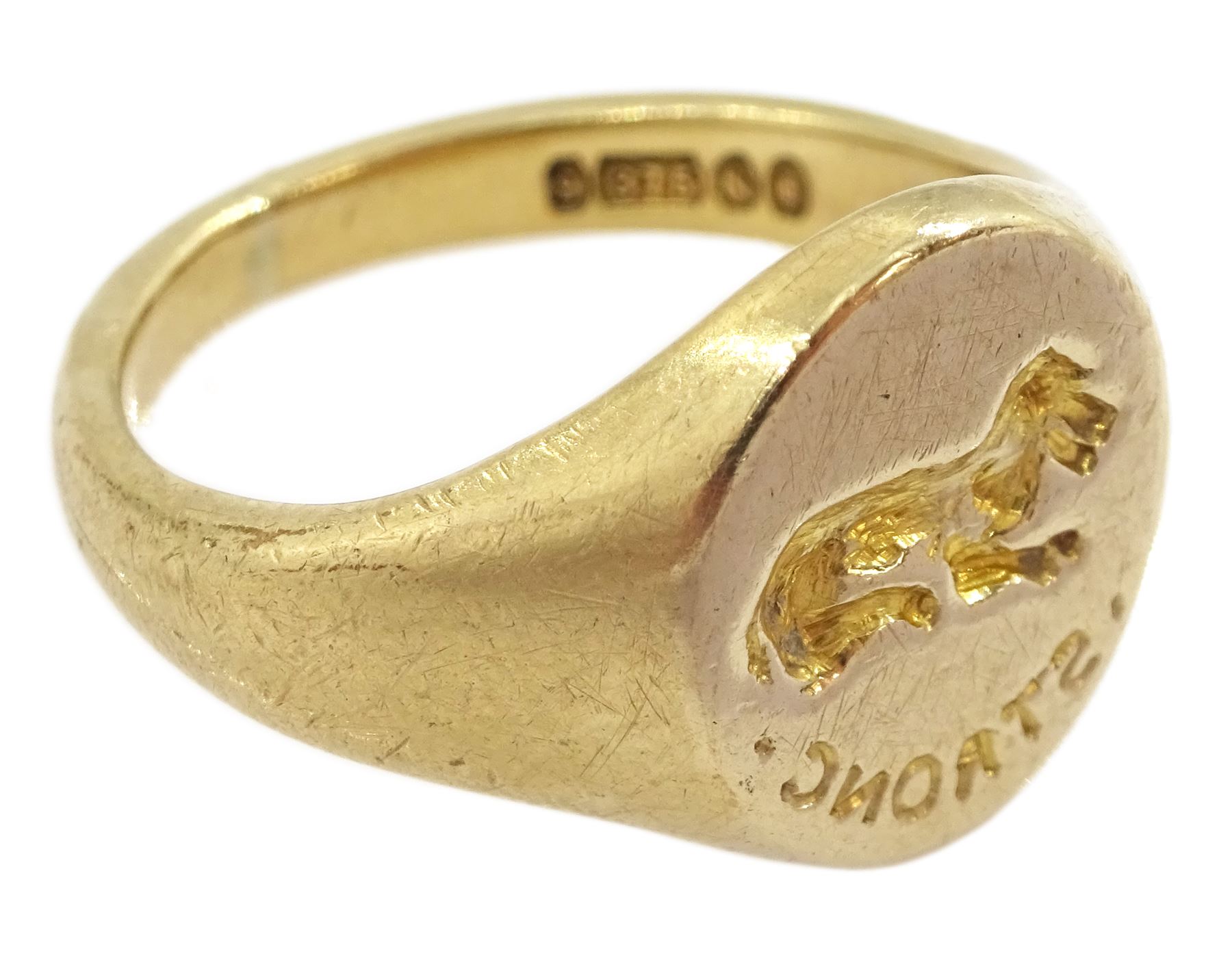 Mid 20th century 9ct gold intaglio signet ring, engraved 'strong' with lying dog above, London 1948