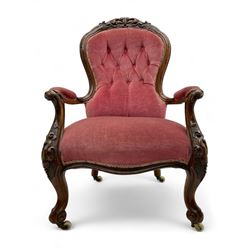 Victorian carved walnut open armchair, foliate carved cresting rail over butted back and s...