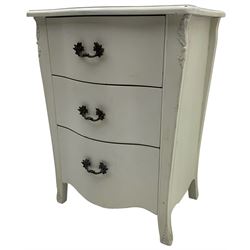 French design cream painted bedside chest, fitted with three drawers, with foliage decoration 