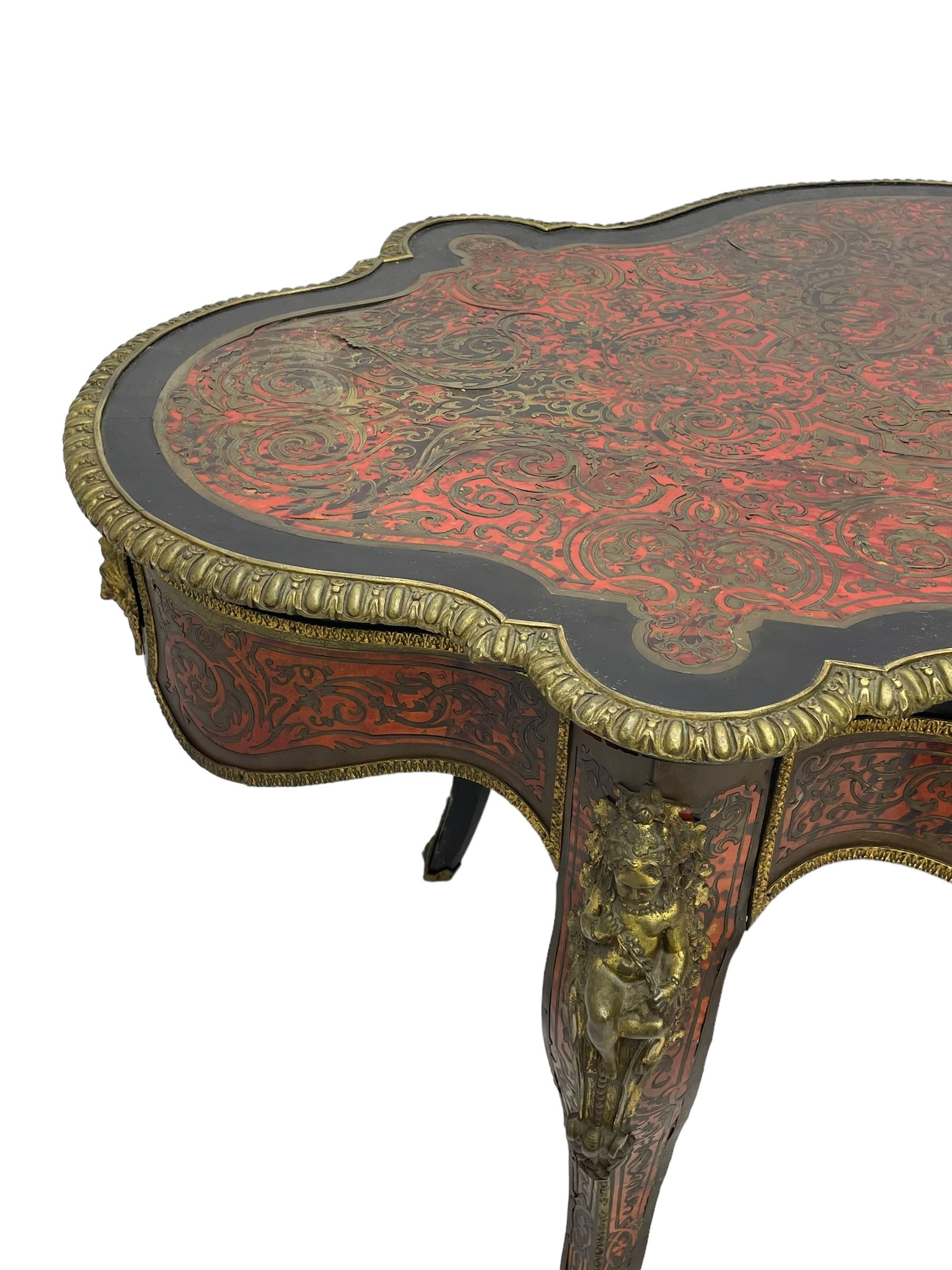 Victorian Louis XV design boulle work centre table, shaped form, decorated extensively with brass and red tortoise shell scroll work, central extending acanthus leaves surrounded by scrolling foliage, gardroon and floral cast brass edge, the frieze rails decorated with further boulle work and green man gilt metal cast masks, the cabriole supports mounted by seated putti mounts on S-scroll brackets surrounded by oak leaves and acorns, ornate scroll and floral cast terminal caps