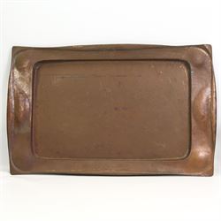 Large Arts & Crafts rectangular copper tray, with lightly hammered decoration and a shaped border, L70.5cm, Art Nouveau oval pewter two-handled tray by Hutton, Sheffield, L49cm over handles, and a stainless steel oval tray by Hugh Wallis, L36cm (3)