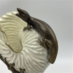 A late 19th Century Royal Worcester vase modelled as a nautilus shell surmounted by a gilt lizard, raised upon a naturalistically modelled gilt coral stem, and spreading base detailed with sea shells and formal shell border to edge, with puce mark beneath with date cypher for 1887, and impressed mark, H22cm

