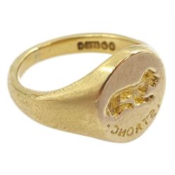 Mid 20th century 9ct gold intaglio signet ring, engraved 'strong' with lying dog above, London 1948