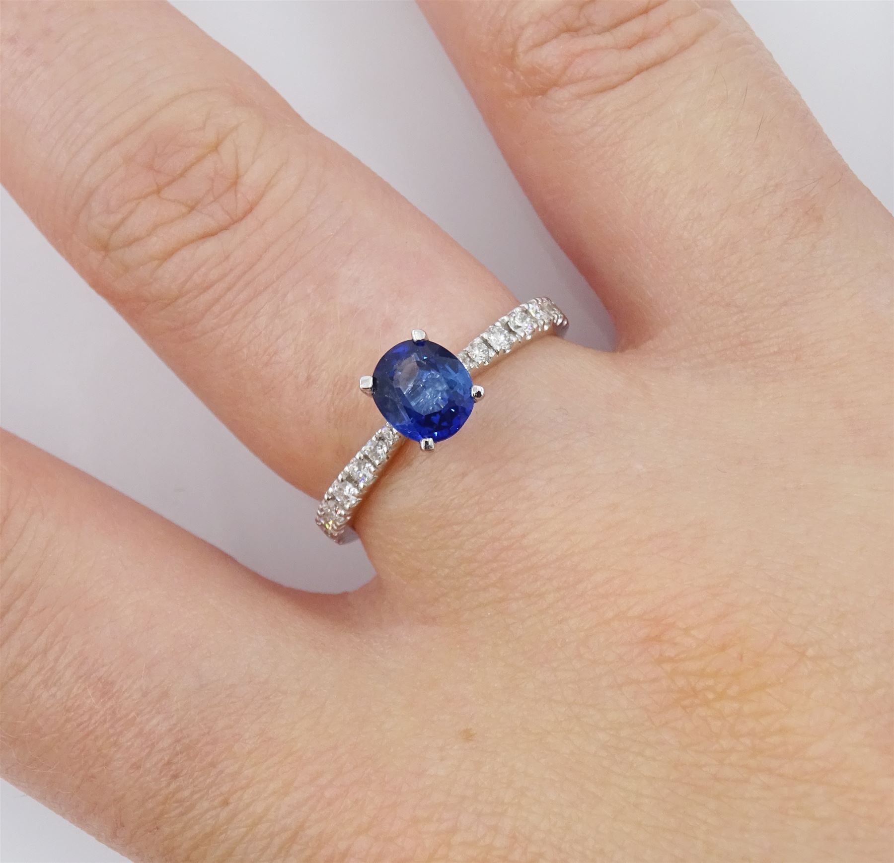 18ct white gold oval cut Ceylon sapphire ring, with diamond set shoulders, sapphire approx 0.90 carat