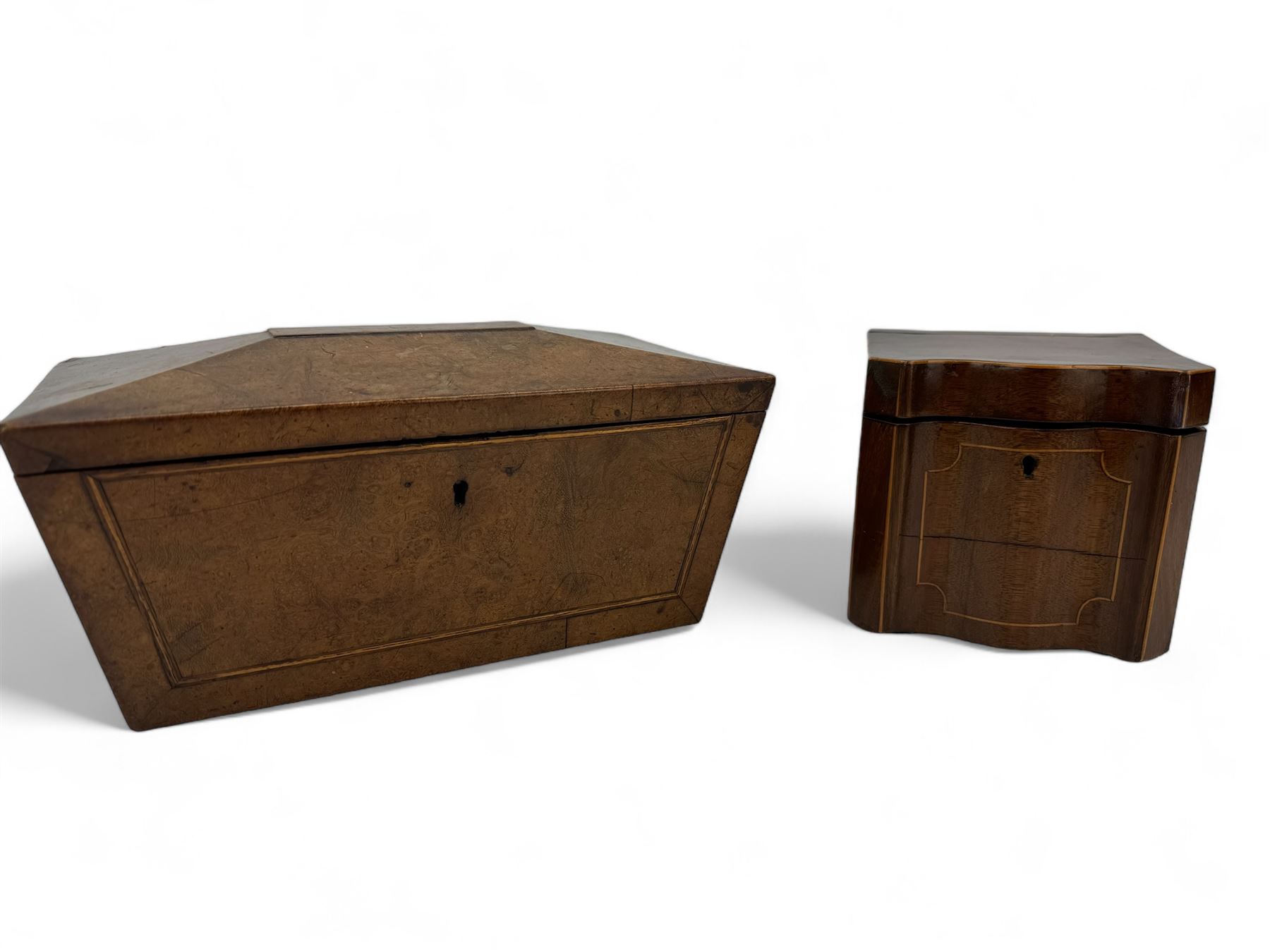 Late Georgian burr walnut sarcophagus shape tea caddy W26cm and a mahogany caddy of serpentine outline W12cm