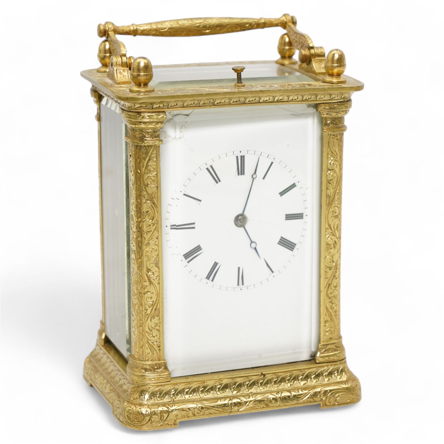 Auguste of Paris - mid-19th century carriage clock in a foliate engraved case with acorn finials and conforming carrying handle, white enamel dial with makers name, Roman numerals, minute track and fine matching steel moon hands,  engraved rear door revealing a twin train going barrel movement striking the hours and half hours on a bell, with the original jewelled lever platform escapement and repeat function, back plate stamped Auguste-Paris, 