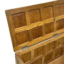 Sid Pollard (ex. Mouseman) - Yorkshire oak blanket chest, all over panelling, enclosed by hinged lid, on octagonal feet, interior plaque inscribed 'S. Pollard, Bagby, Thirsk, Yorks' 