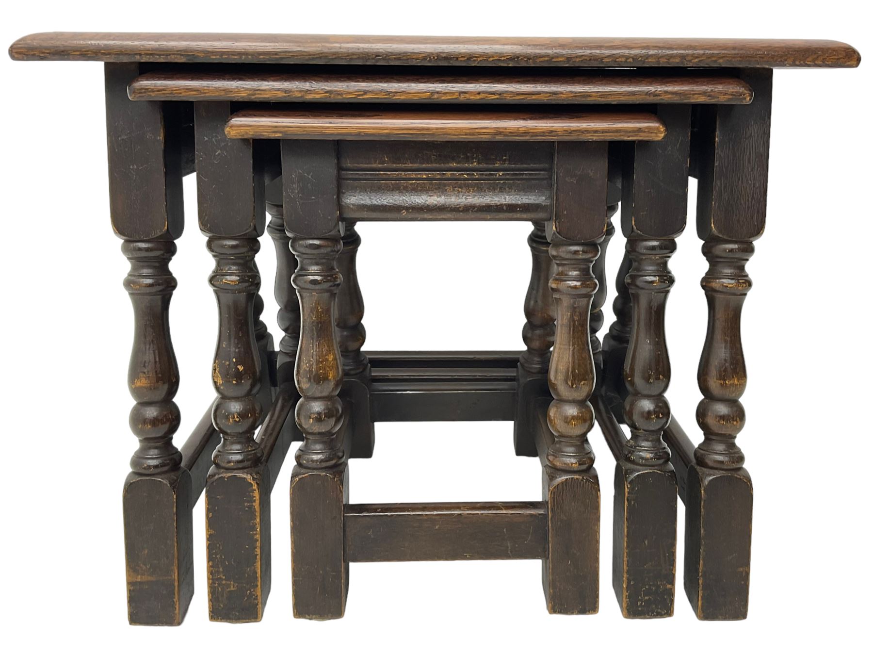 Mid-to-late 20th century medium oak nest of three occasional tables