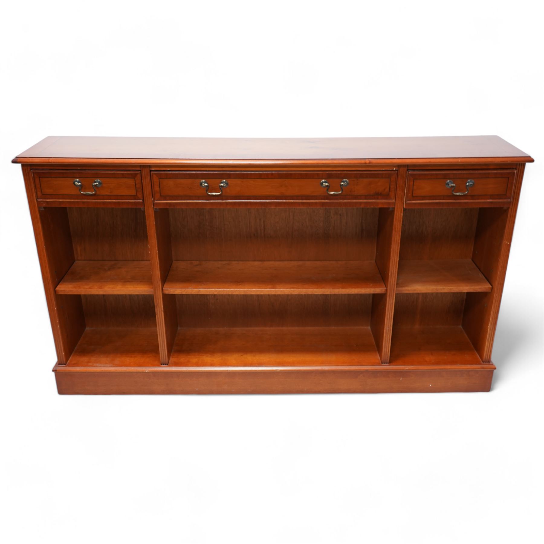 Georgian design yew wood open bookcase, fitted with three drawers above three open shelves, flanked by fluted uprights