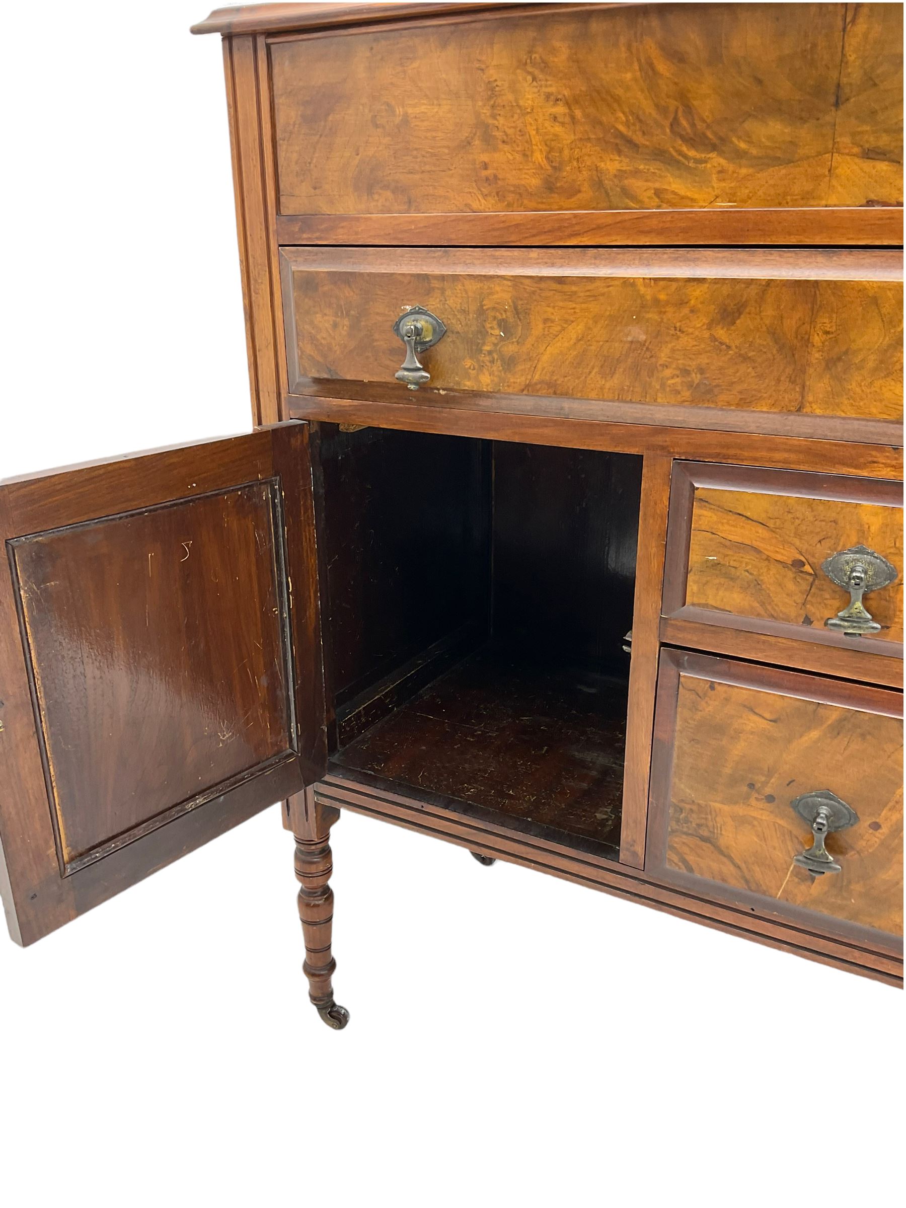 Edwardian walnut gentleman's tallboy, moulded hinged lid enclosing divisions, long drawer over two short drawers and panelled cupboard, turned supports terminating at ceramic castors