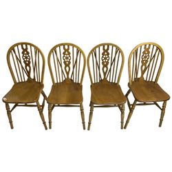 Set of four elm and beech wheelback dining chairs