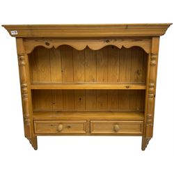 Pine farmhouse wall hanging shelf, shaped apron over single shelf and two drawers, flanked by split turned pilasters
