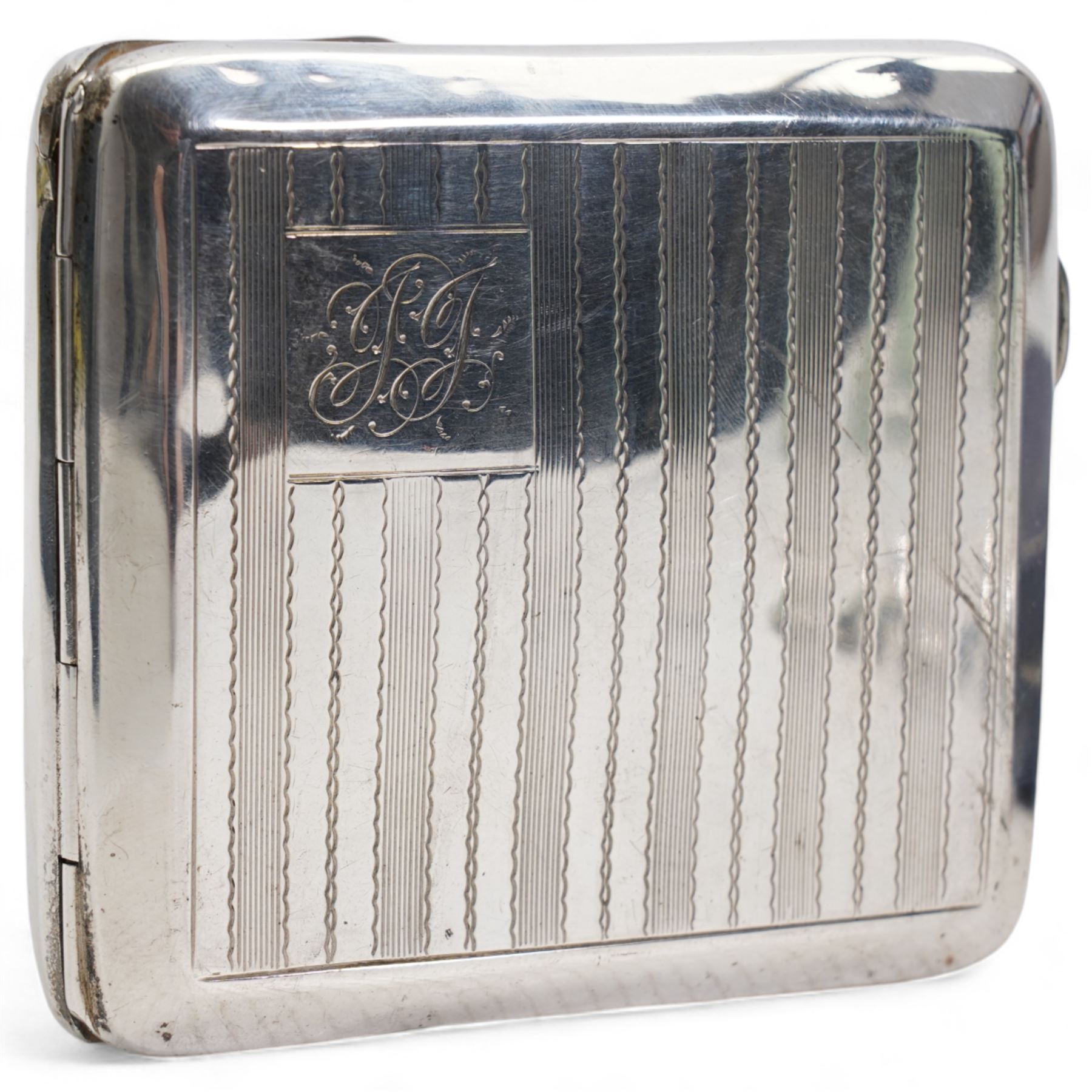 Silver engine turned cigarette case engraved with initials Birmingham 1922, eleven silver coffee spoons, cased and five silver teaspoons 