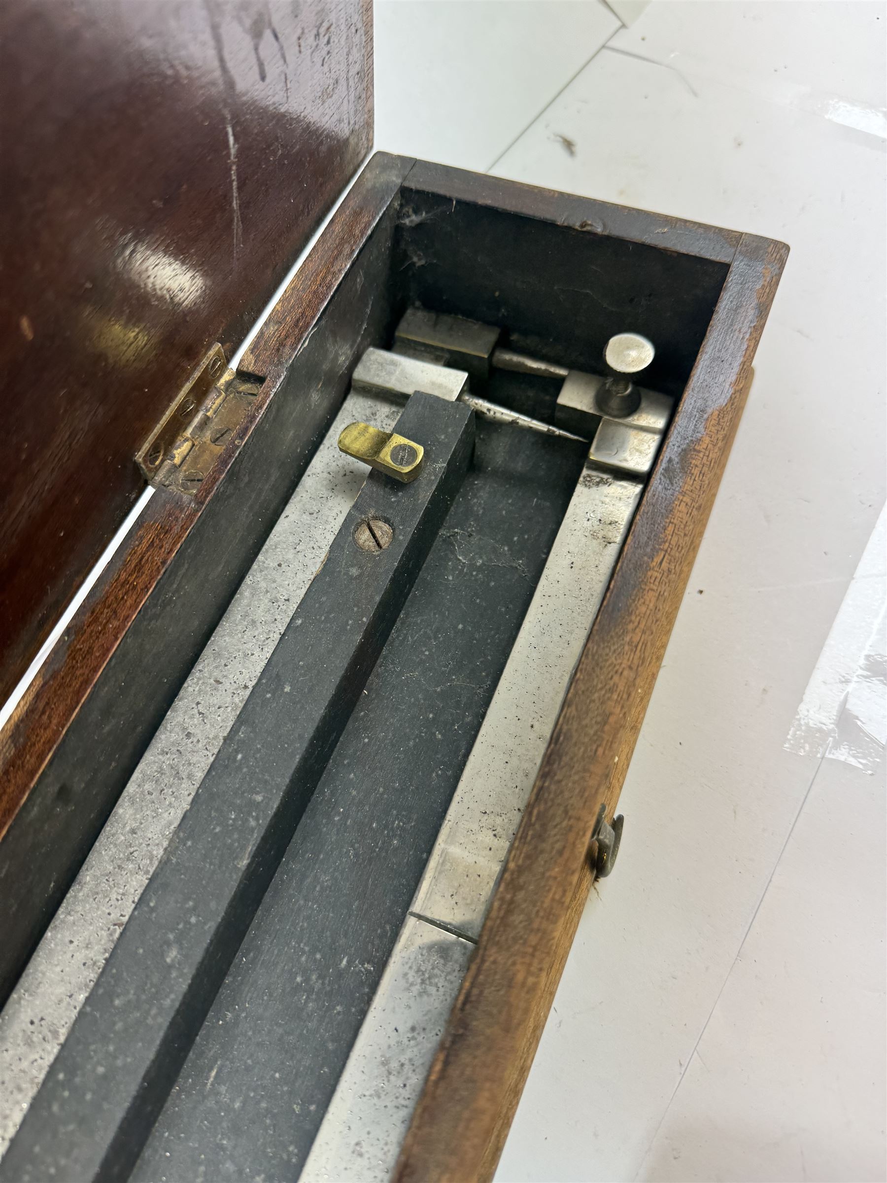 Early 20th century drawing instruments, to include a boxed set of large compasses, possibly for map drawing, marked 5, 6 and 7 miles, in fitted wooden case, together with two rules marked W. Harling and a parallel rule stamped R. E & Co MK II, all with broad arrow mark, contained within leather cases