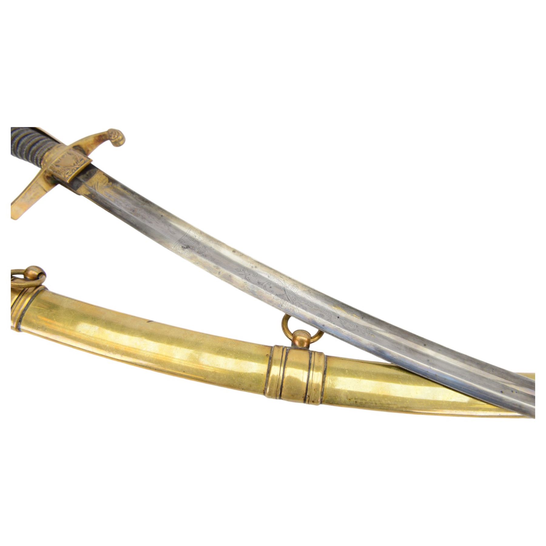 German Saxon 1st Empire Light Cavalry officer's sword c1820s, the 79cm clipped curving blade engraved with the crest of Hanover and various battle trophies with traces of blueing and gilding, brass hilt with knucklebow, foliate square langets, ornate downswept quillon, wire-bound fish skin grip with lion's head pommel; in brass scabbard with two suspension rings L95cm overall