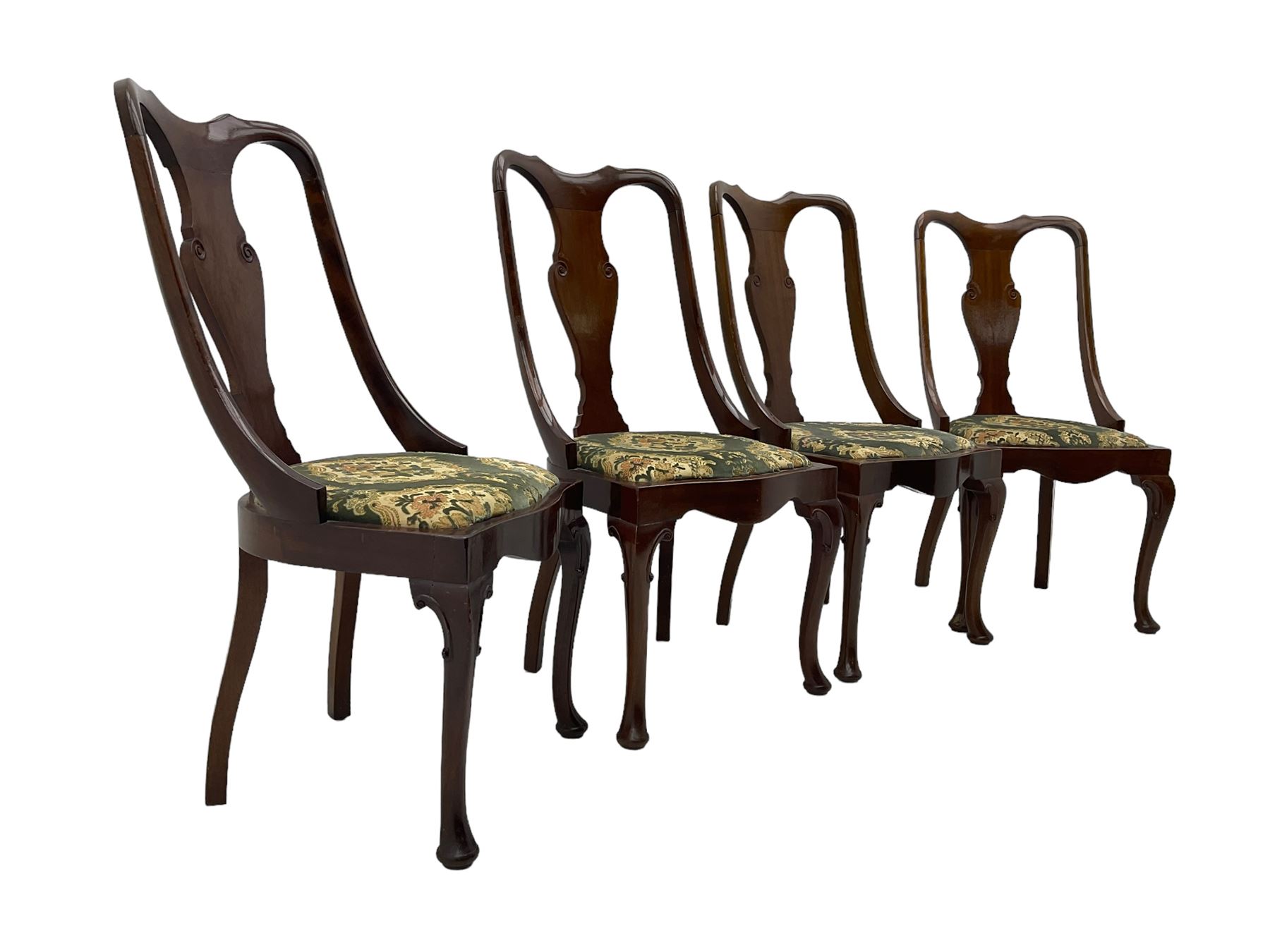 Set of eight late 19th century mahogany spoon back dining chairs, each with shaped top rail over Queen Anne design vase-shaped splat, upholstered seats in floral patterned fabric, raised on cabriole supports with scroll carved knees