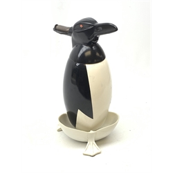 A Russian Soviet period soda siphon, modelled as an enamel penguin, and raised upon a plastic drip tray, H35.5cm 