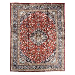 Central Persian Kashan carpet, the red field centred by a large multi-lobed floral medalli...