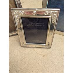 Two silver photograph frames, hallmarked and a plated frame, largest H17.5cm