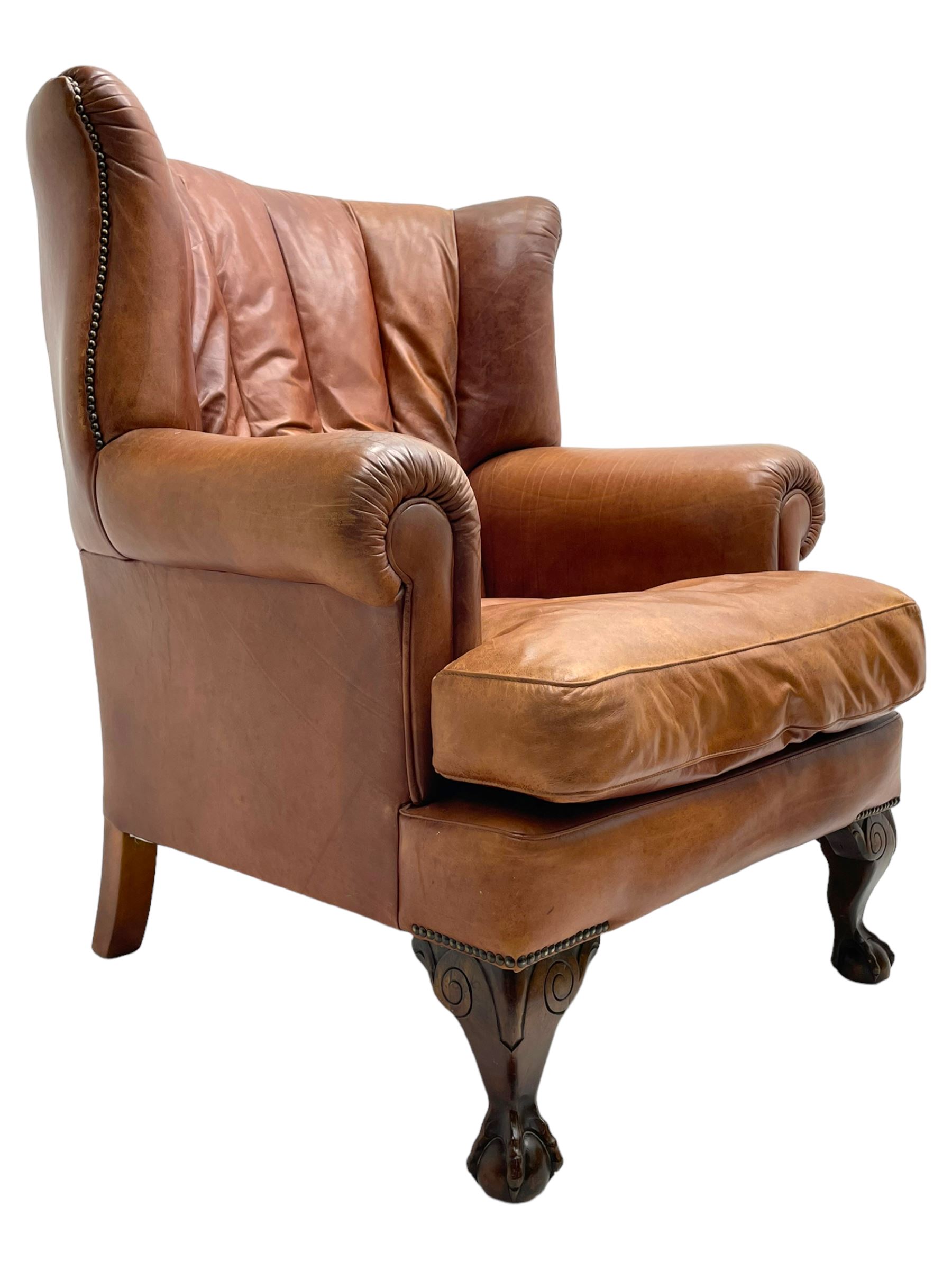 Tetrad - 'Blake' club armchair, fanned wingback and rolled arms upholstered in tan brown leather, on ball and claw carved cabriole feet 