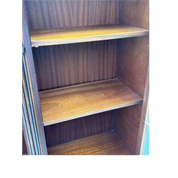 Georgian design mahogany bookcase on cupboard, projecting moulded and dentil cornice, two display cabinets enclosed by glazed doors above over three drawers and three cupboards, on bracket feet