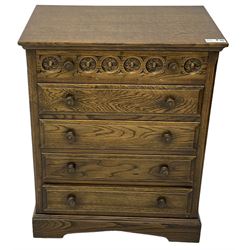 Mid-20th century oak chest, fitted with five drawers, the top drawer carved with flower head roundels, on bracketed plinth base 