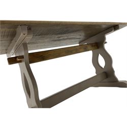 20th century oak refectory dining table, rectangular stripped top on painted base, shaped end supports on sledge feet united by two pegged stretchers