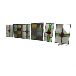 Six leaded stained glass window panes, largest measuring - 46cm x 41cm