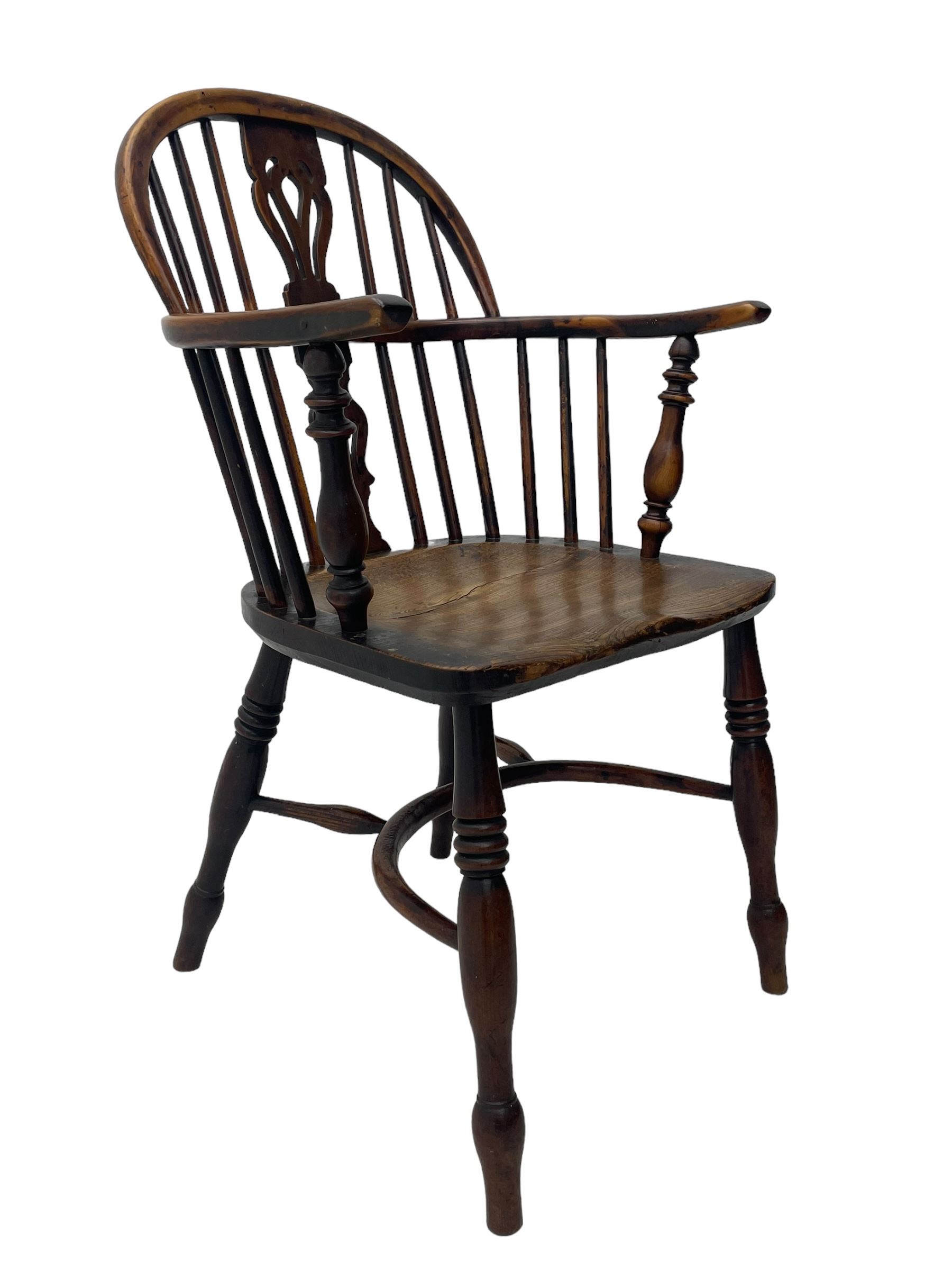 19th century yew wood and elm Windsor armchair, low double hoop stick and pierced splat back, dished seat on turned supports united by crinoline stretchers