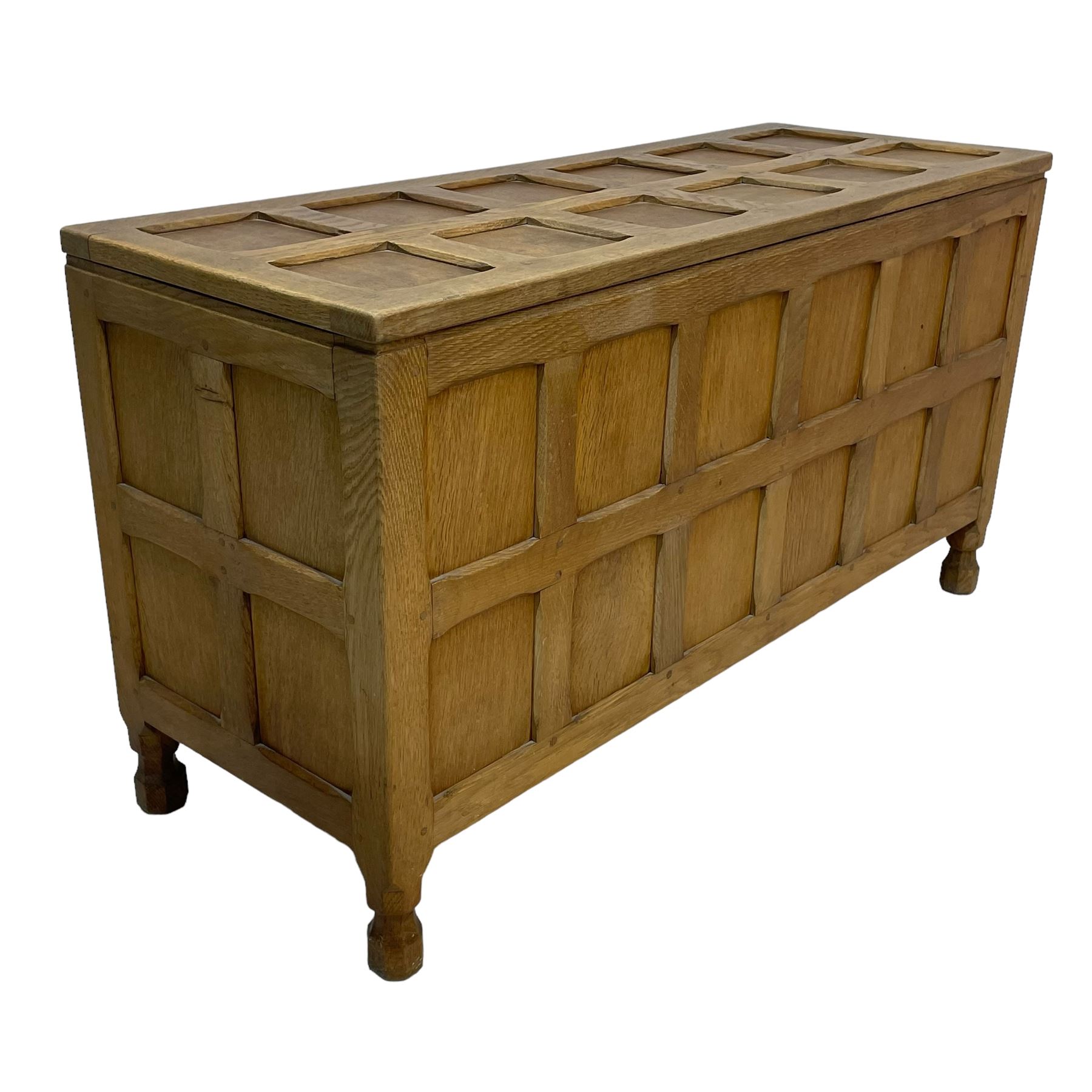 Sid Pollard (ex. Mouseman) - Yorkshire oak blanket chest, all over panelling, enclosed by hinged lid, on octagonal feet, interior plaque inscribed 'S. Pollard, Bagby, Thirsk, Yorks' 