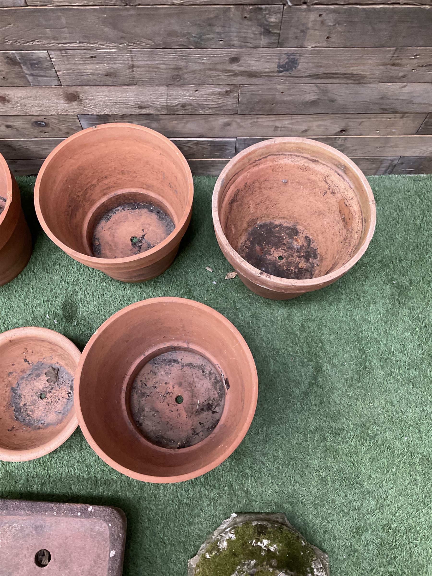 Set of five terracotta planters, small stone trough and urn plinth  - THIS LOT IS TO BE COLLECTED BY APPOINTMENT FROM DUGGLEBY STORAGE, GREAT HILL, EASTFIELD, SCARBOROUGH, YO11 3TX