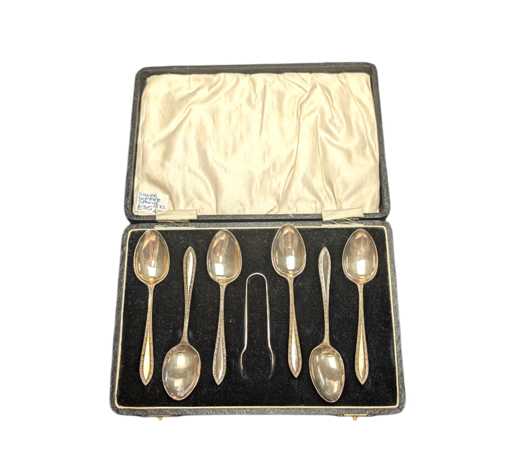 Cased set of six silver coffee spoons and a pair of sugar tongs, hallmarked 