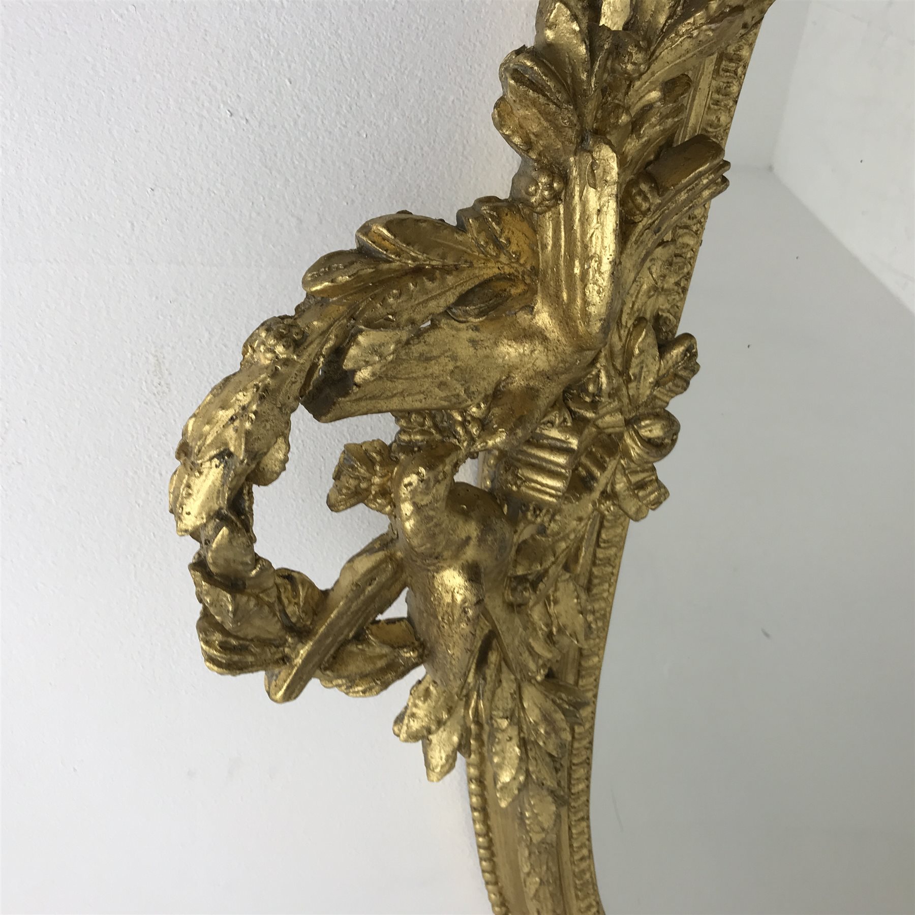 Victorian gilt wood and gesso framed overmantel mirror, the pediment ...