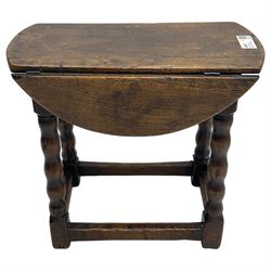 Small oak drop-leaf occasional table, lunette carved end rails, on bobbin turned supports united by stretchers 