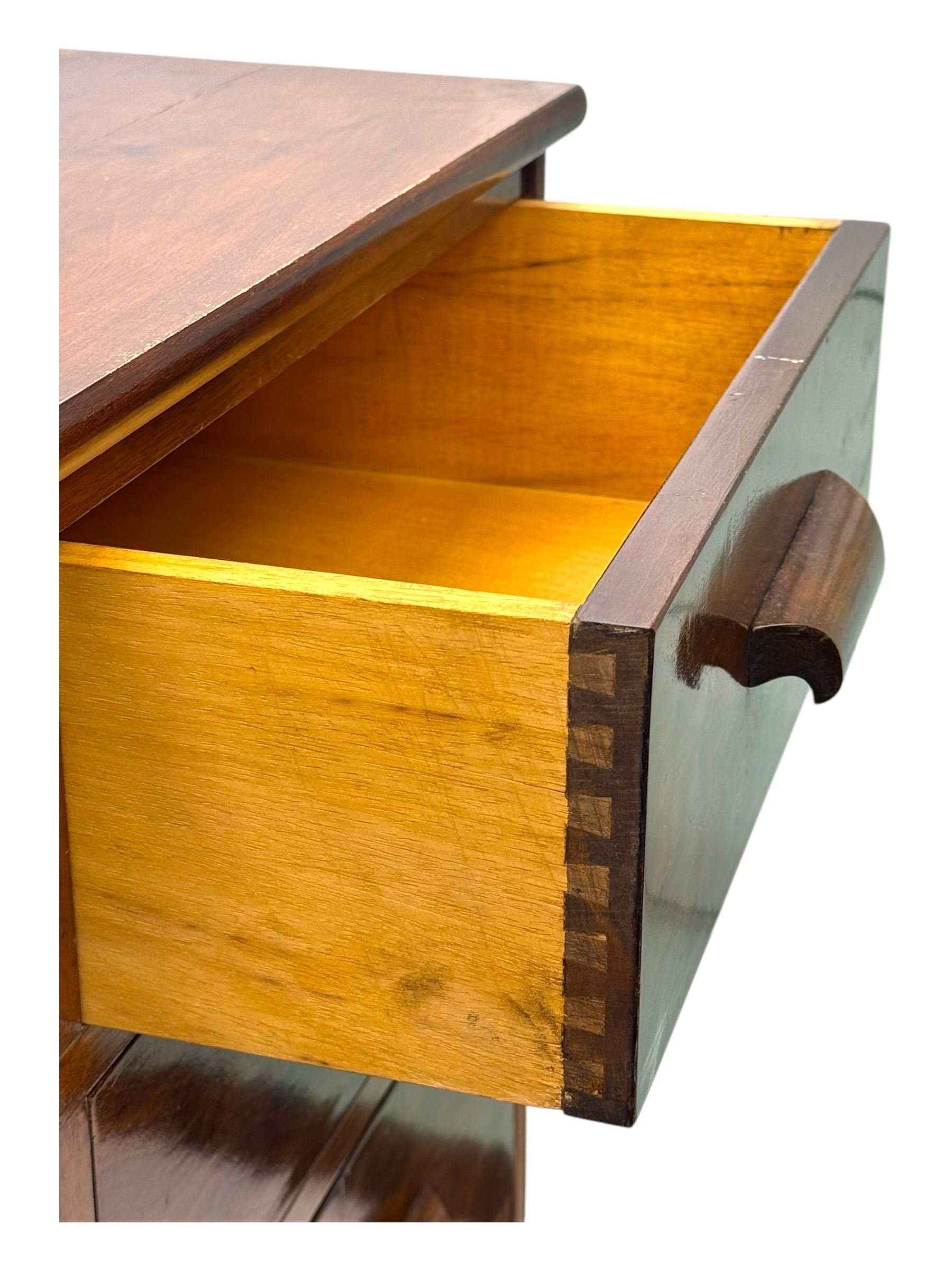 Early 20th century walnut chest, fitted with four short and four long drawers, on recessed plinth base