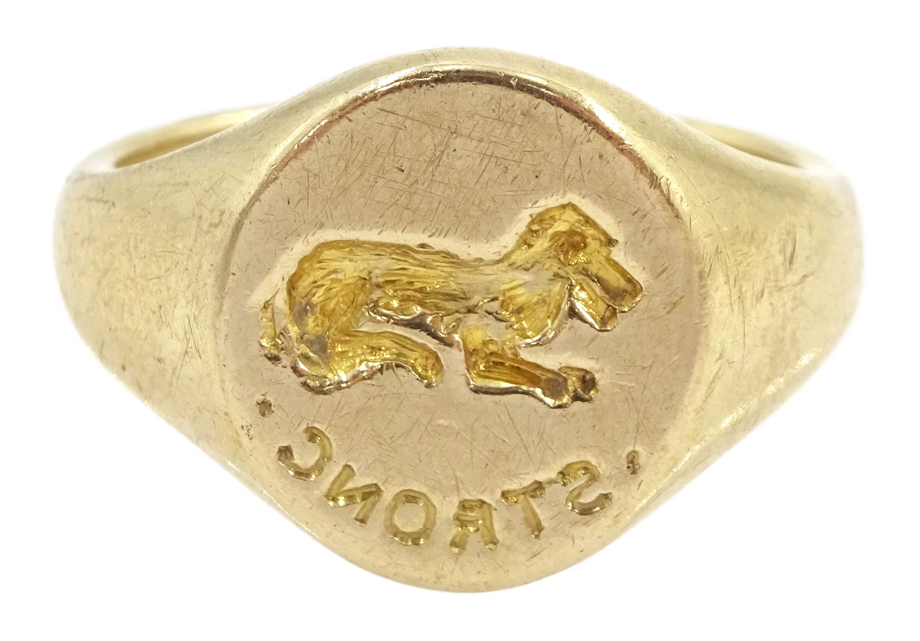 Mid 20th century 9ct gold intaglio signet ring, engraved 'strong' with lying dog above, London 1948