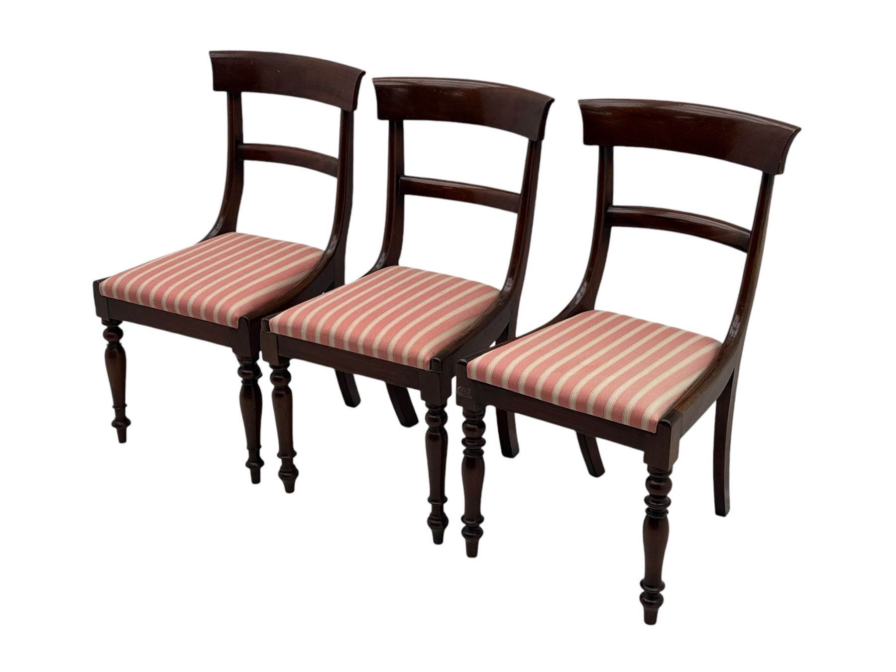 Set of six Victorian mahogany dining chairs, curved bar back over drop-in seat upholstered in striped fabric, on turned front supports