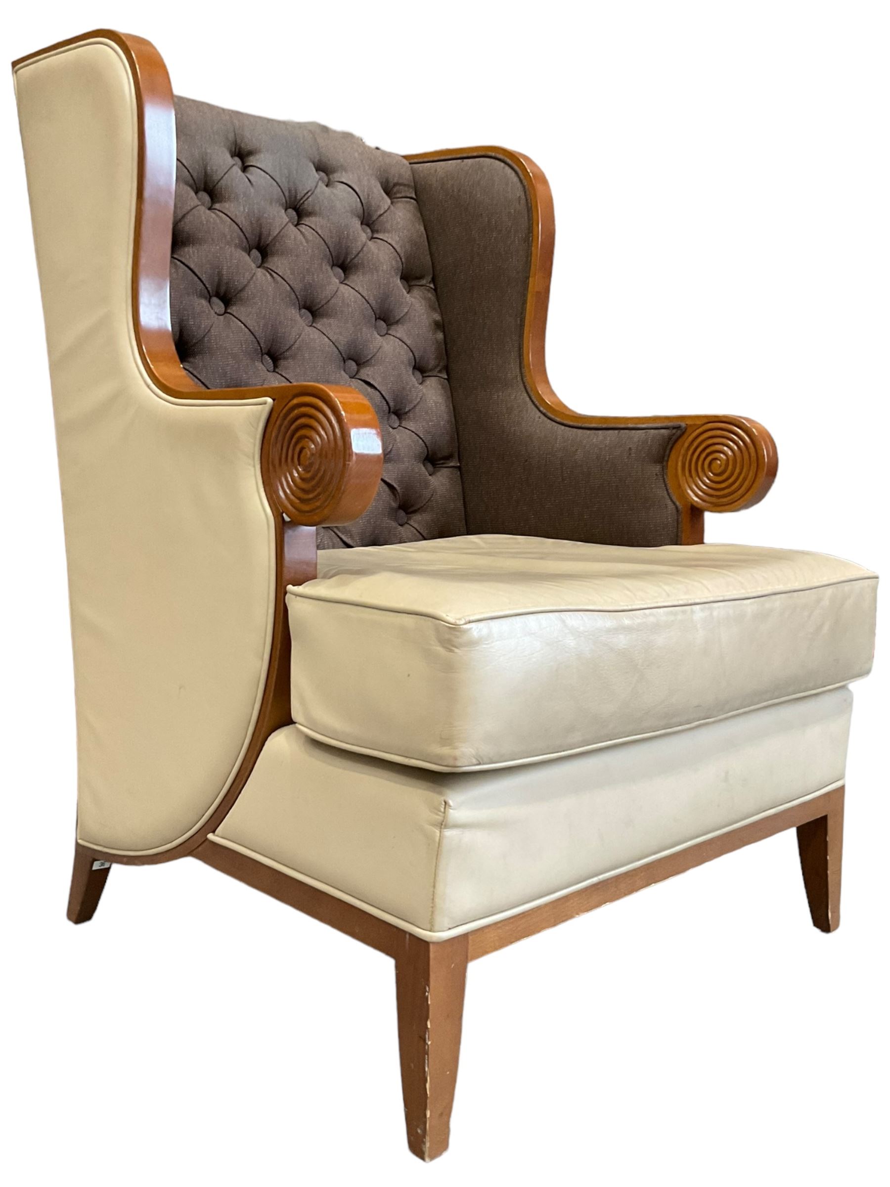 Walnut finish framed wing back armchair upholstered leather and buttoned fabric