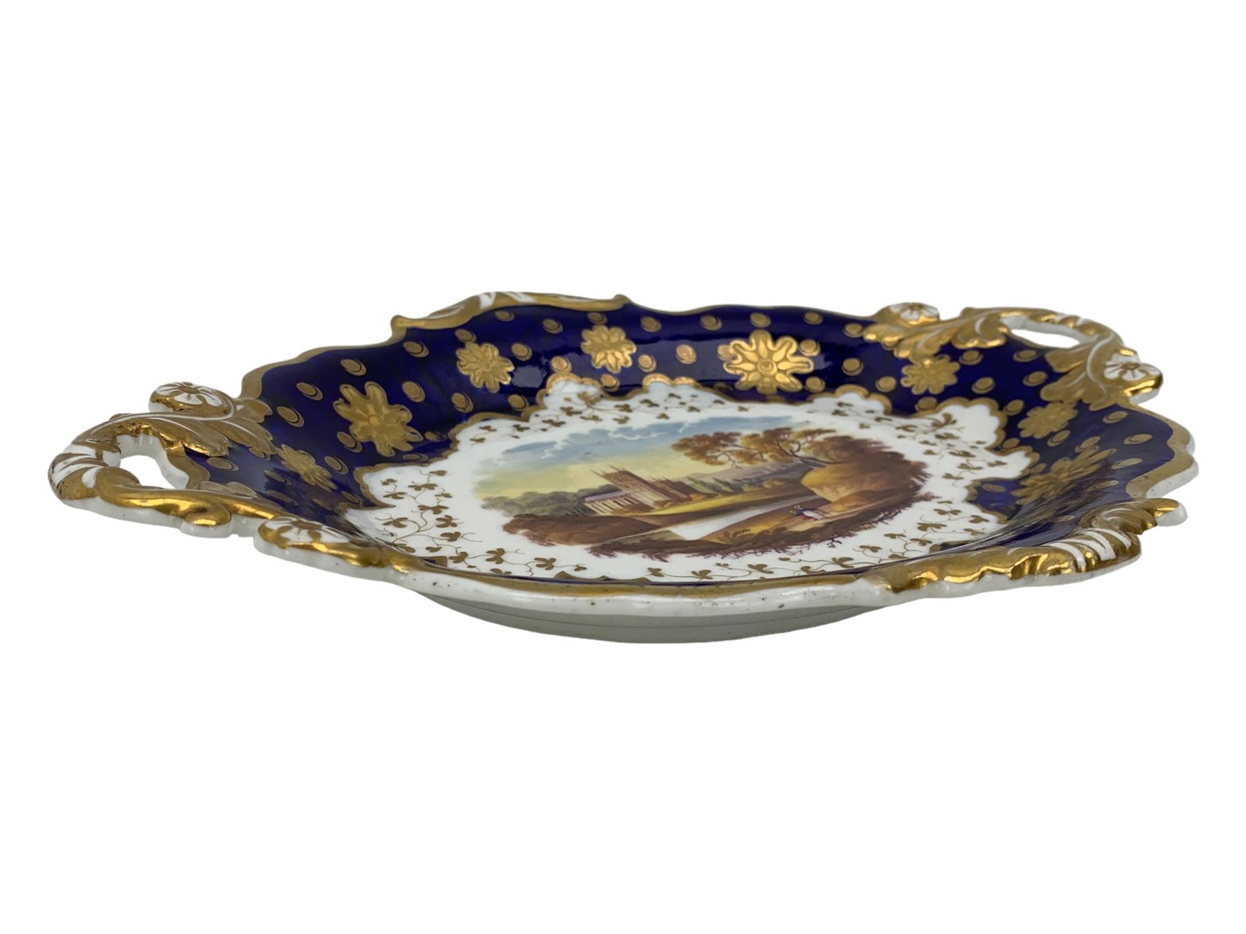 Early 19th century Ridgway twin handled oval dish, hand painted with figures in a river landscape, within a cobalt blue and moulded border, L30cm together with a similar twin handled serving dish, L28cm (2)