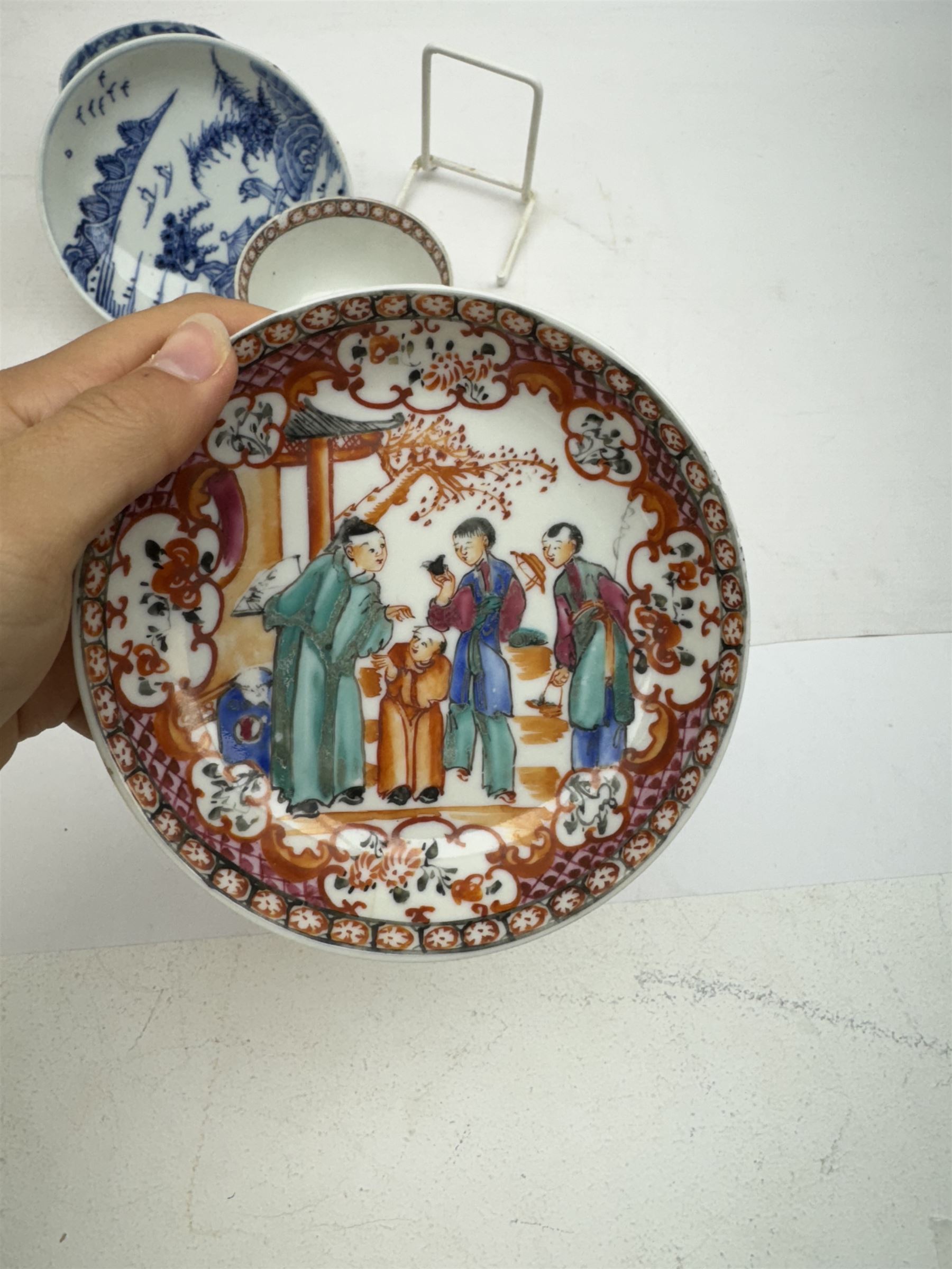 19th Century Chinese tea bowl and saucer, decorated with figures in a garden scene, together with tow other tea bowls and a saucer 