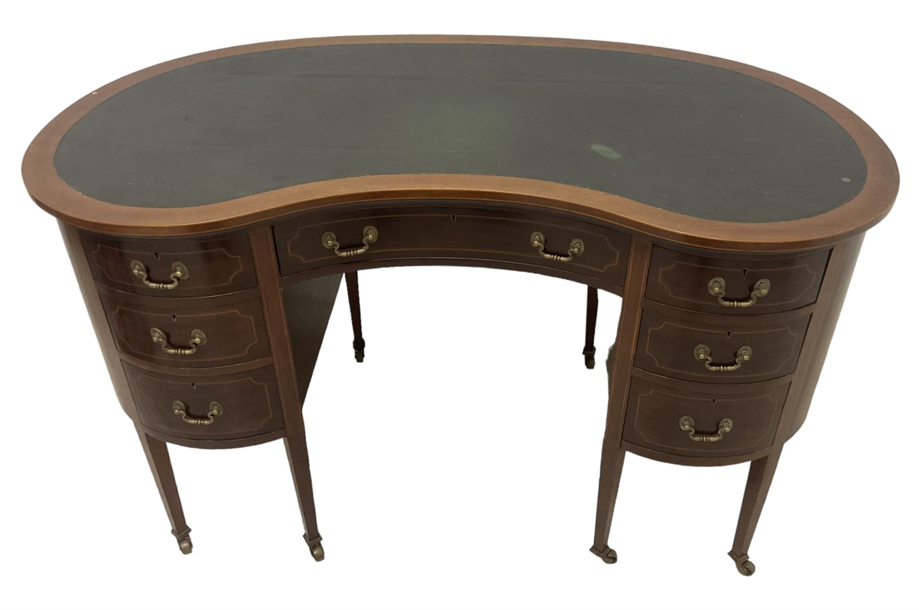 Georgian design mahogany kidney shaped desk, fitted with green leather writing surface, over single frieze drawer and six graduating drawers with checkered inlaid stringing, square tapering supports with castors