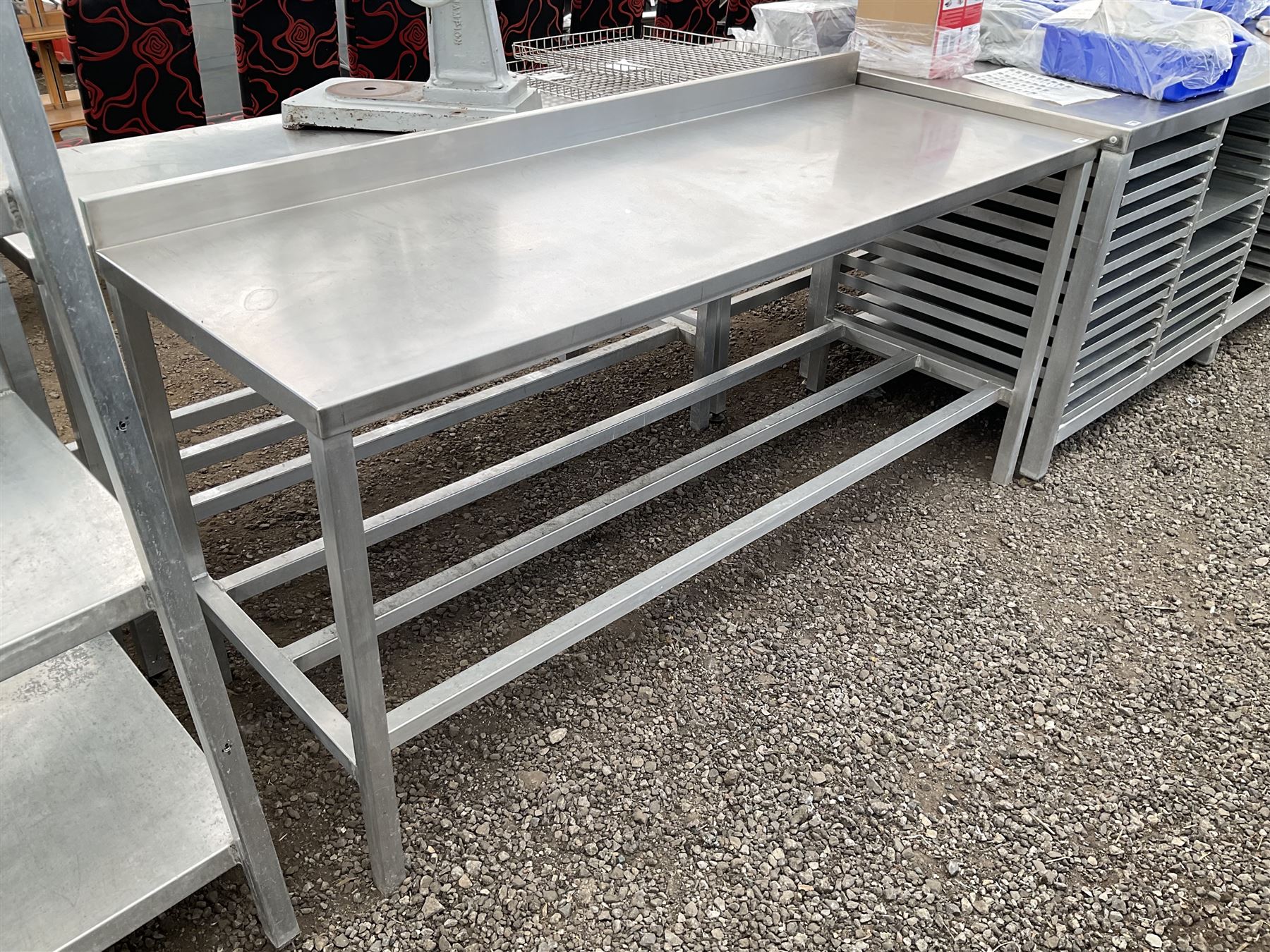 Aluminium framed preparation table with stainless top, barred under-tier, raised back - THIS LOT IS TO BE COLLECTED BY APPOINTMENT FROM DUGGLEBY STORAGE, GREAT HILL, EASTFIELD, SCARBOROUGH, YO11 3TX