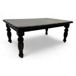 19th century heavily carved oak extending dining table, rectangular top with rounded corne...