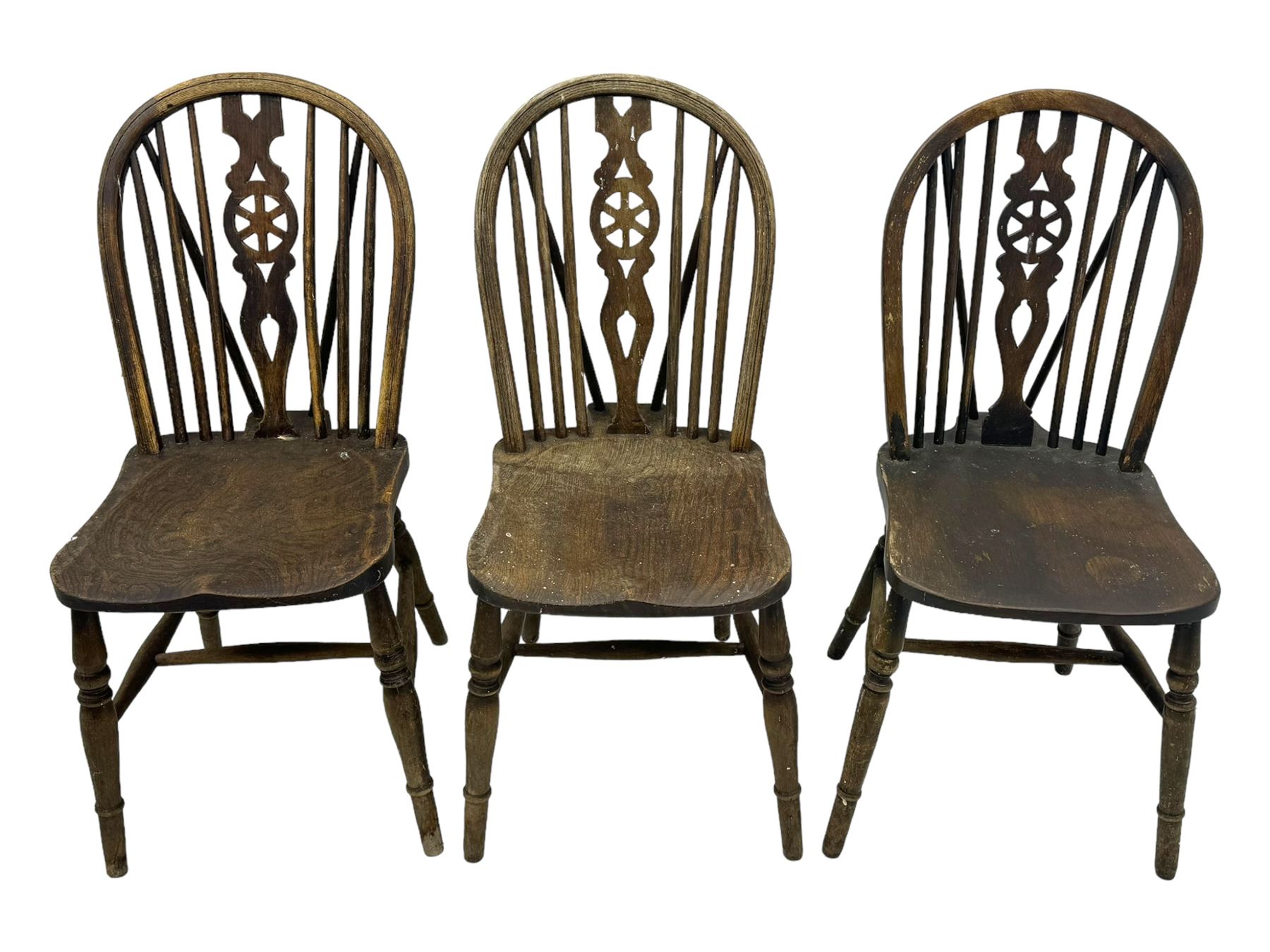 Mid-to-late 20th century set of six elm and beech Windsor dining chairs, hoop and stick back with pierced wheel splat, dished elm seat, on turned supports united by turned stretchers 