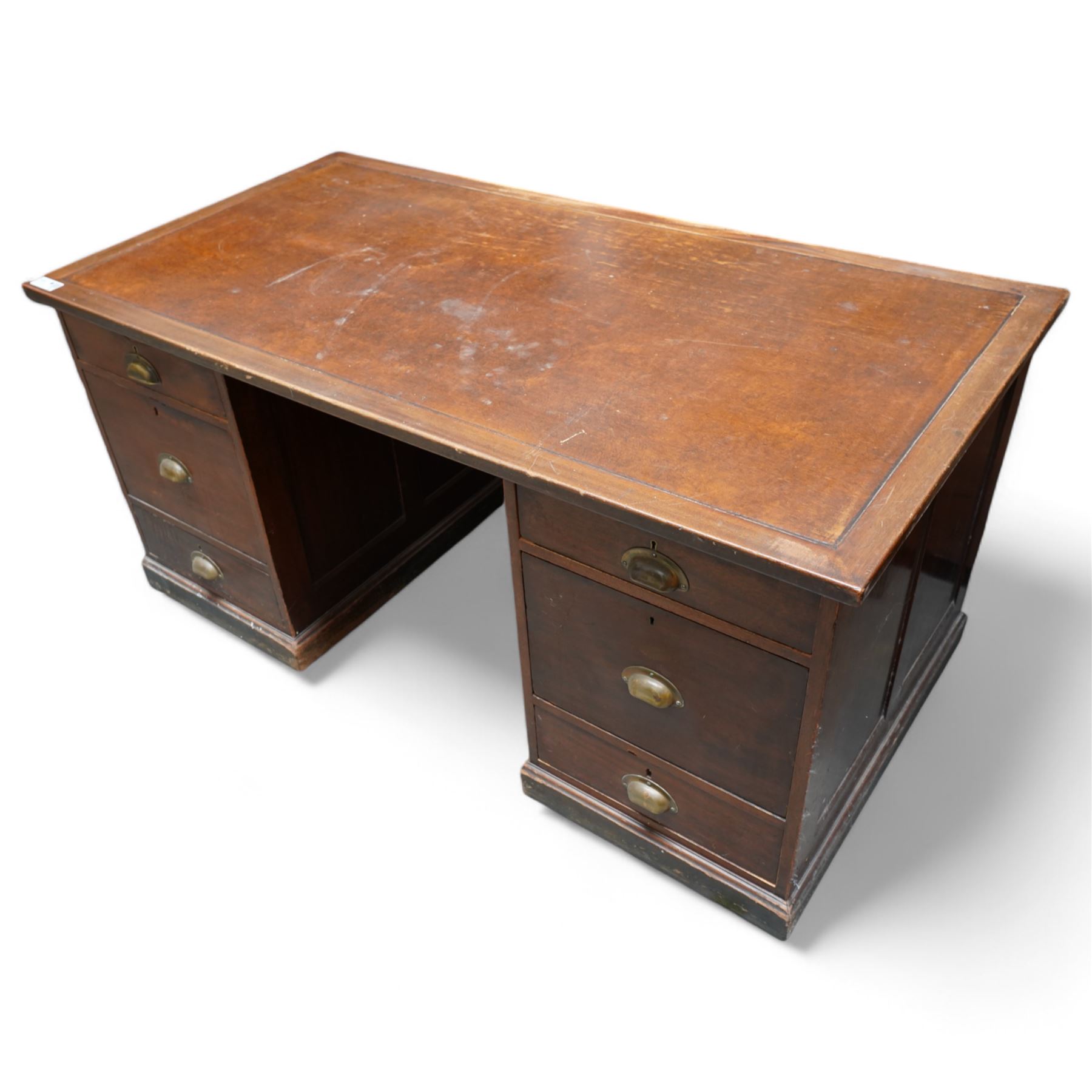 Early 20th century mahogany twin pedestal desk, rectangular top with brown leather inset, fitted with six drawers with brass cup handles, moulded plinth base