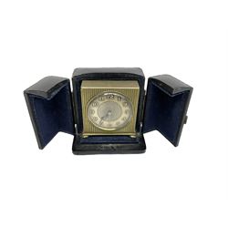 Two 20th century compact traveling alarm clocks -  in blue case with opening doors and an Equity travel clock, both wound and set from the rear.