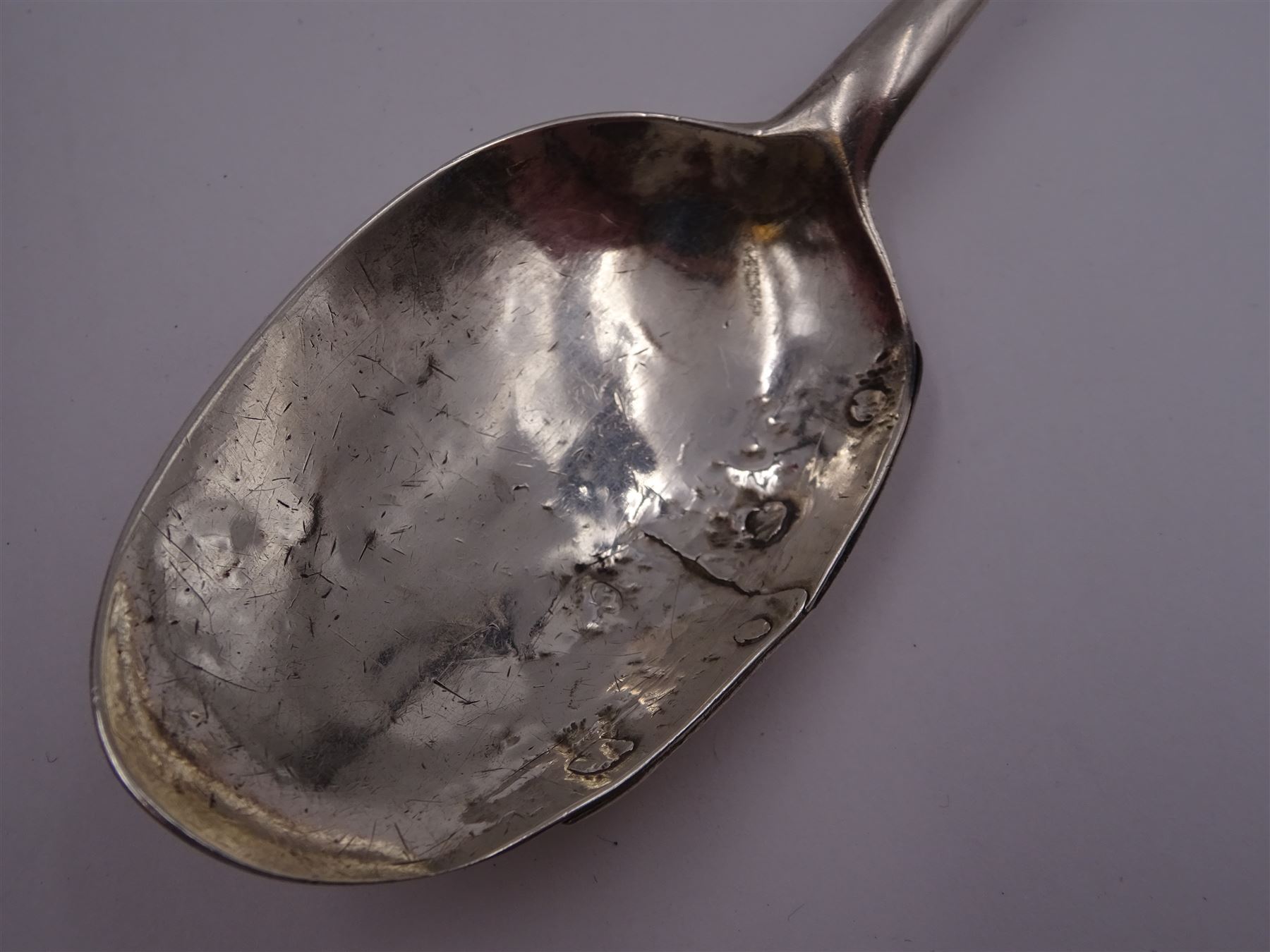 17th century silver trifid spoon, marks worn and indistinct, together with an Old English pattern silver spoon