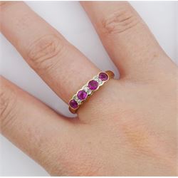 9ct gold ruby and diamond ring, four round cut rubies, each with two round brilliant cut diamonds set between, hallmarked