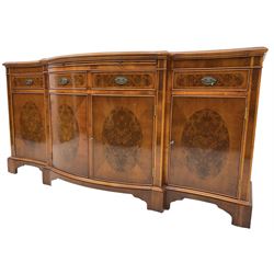 Wade - Georgian design yew wood bow-fronted sideboard, projecting moulded top over four cockbeaded frieze drawers, the central two with pull-out slides, four cupboards below with figured veneers, raised on bracket feet